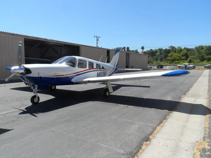 Blue-striped single-engine aircraft